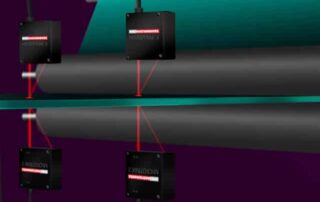 Mikrotrak Lasers set up to measure thickness of extruded sheet metal