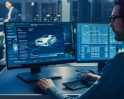 Man performing electrical tests on a new car