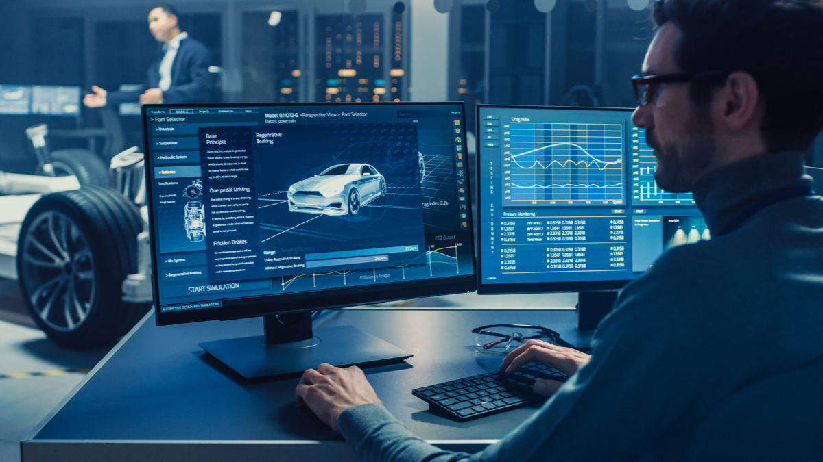 Man performing electrical tests on a new car