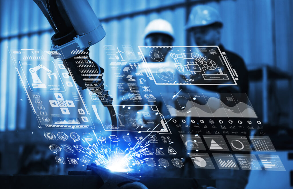 Digital future manufacture concept, Industrial Engineer working with automation robot arms machine on real time monitoring system software.
